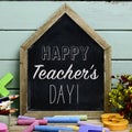 Text happy teachers day in a chalkboard Royalty Free Stock Photo