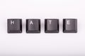 Text hate formed with computer keyboard keys on white background Royalty Free Stock Photo