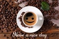 Text Have a nice day, cup of hot aromatic coffee and roasted beans on wooden table, flat lay Royalty Free Stock Photo