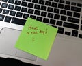 Text Have a nice day on sticky note. Green sticky note on keyboard