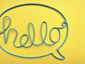 The word `HELLO` is made of blue wire.