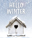 Text hello winter with cute little bird house under snow quote Royalty Free Stock Photo