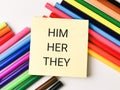 Text HIM HER THEY written on sticky note. Royalty Free Stock Photo