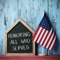 Text honoring all who served and american flag