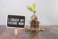Text I CREATE MY FUTURE NOW on sticky notes with copy space and paper clip isolated on red background. Royalty Free Stock Photo