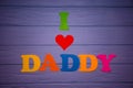 Text `I love daddy` of colorful paper alphabet