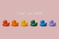 Text I love you moms and rainbow rubber ducks Royalty Free Stock Photo