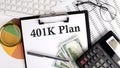 Text 401 K PLAN on Office desk table with keyboard,dollars,calculator ,supplies,analysis chart on white background