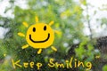 A text `keep smiling` in concept to cheer up