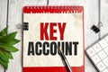 Text KEY ACCOUNT on a notebook on the diagram and charts with calculator and pen Royalty Free Stock Photo