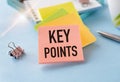 Text KEY POINTS on short note texture background with pen on Blue Background Royalty Free Stock Photo