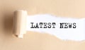 The text LAST NEWS appears on torn paper on white background