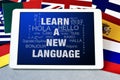 Text learn a new language in a tablet computer Royalty Free Stock Photo