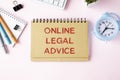 The text of legal advice online on a notepad, lying on the table