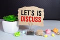 text Let's is Discuss on torn paper Royalty Free Stock Photo