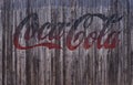 Text lettering Coca-Cola an ancient wooden background Royalty Free Stock Photo