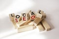 Text Local Seo written on wooden blocks and white background. Concept meaning An incredibly effective way to promote your business Royalty Free Stock Photo