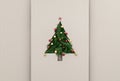 Text or logo empty copy space in vertical top view cardboard with natural eco decorated christmas tree pine.Xmas winter