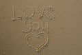 Love You written in the sand and a heart drawn in the sand Royalty Free Stock Photo