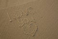 Love You written in the sand and a heart drawn in the sand Royalty Free Stock Photo