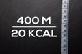Text 400 M - 200 KCAL write on black table Royalty Free Stock Photo