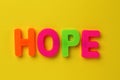 Text made in multicolored magnetic letters. HOPE