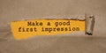 The text Make a good first impression appearing behind torn brown paper Royalty Free Stock Photo