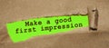 The text Make a good first impression appearing behind torn brown paper Royalty Free Stock Photo