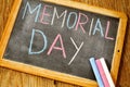 Text memorial day written with chalk in a chalkboard