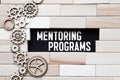 text Mentoring Programs on wooden block, concept Royalty Free Stock Photo