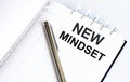 Text NEW MINDSET on the short note texture background with pen Royalty Free Stock Photo