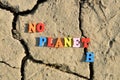 Text No Planet B on arid cracked soil.