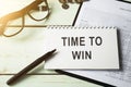 Text on notepad Time to win. Royalty Free Stock Photo