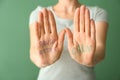 Text PANIC ATTACK and CALM written on woman's palms, closeup
