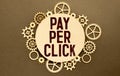 Text pay per click on the short note texture background Royalty Free Stock Photo