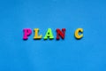 text plan c from plastic colored letters on blue paper background. Royalty Free Stock Photo