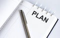 Text PLAN on the short note texture background with pen Royalty Free Stock Photo
