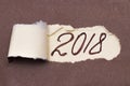 Text Planning 2018 appearing behind ripped brown paper Royalty Free Stock Photo