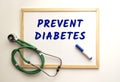 The text PREVENT DIABETES is written on a white office board. Nearby is a stethoscope
