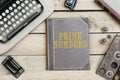 Text Prime Numbers on old book cover at office desk with vintage Royalty Free Stock Photo