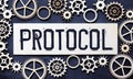 Text PROTOCOL is written on a folder lying on a stack of papers with a pen on the table Royalty Free Stock Photo