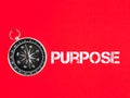 Text PURPOSE on red background with compass. Royalty Free Stock Photo