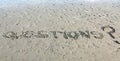 Text QUESTIONS written on the sand Royalty Free Stock Photo