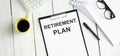 Text Retirement Plan is on the white paper with coffee  calculator and ball Royalty Free Stock Photo