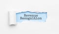 The text revenue recognition appearing behind torn yellow paper Royalty Free Stock Photo