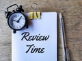 Text REVIEW TIME written on white paper Royalty Free Stock Photo