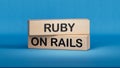 text RUBY ON RAILS. Wooden cube blocks