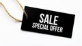 Text SALE SPECIAL OFFER on a black tag on a white paper background Royalty Free Stock Photo