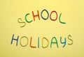 Text School Holidays made of modelling clay on background, flat lay Royalty Free Stock Photo