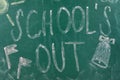 Text School`s Out and drawings on chalkboard. Summer holidays